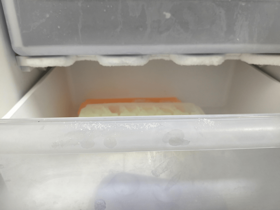 Spoiled food inside commercial fridge