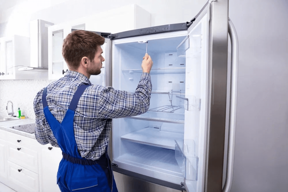 Checking components inside commercial fridge